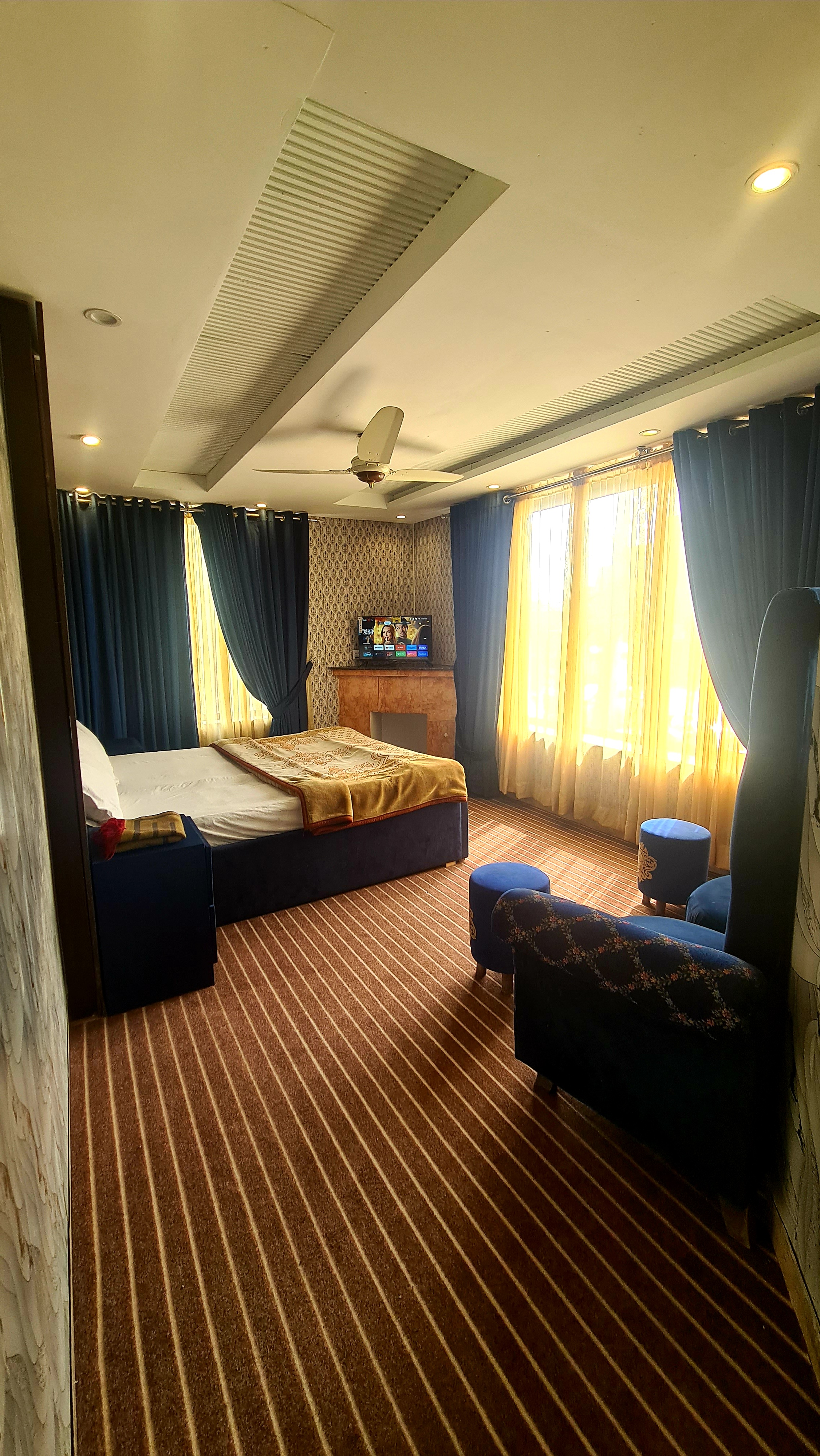 Standard room at Hotel Five Rivers Lahore with queen bed and clean modern interiors
